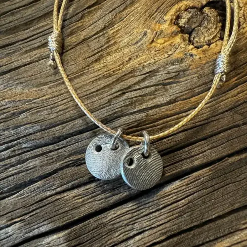 Barren-Hundemarke aus Bronze mit Pfotenabdruck